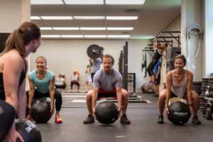 fitness class working with medicine balls