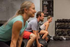 fitness class working with medicine balls