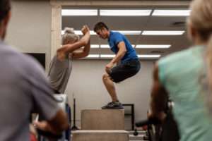 people doing box jumps