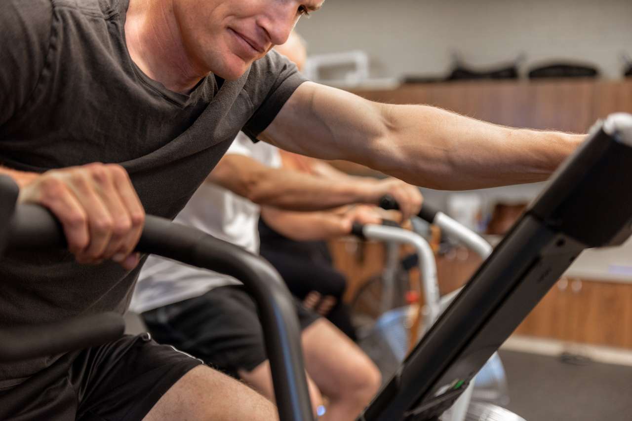 closeup of people working out on exercise bikes