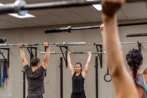 coach instructing weight training class