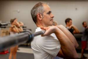 closeup of a man in a weight training class