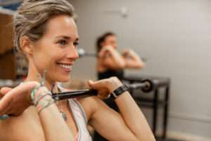 closeup of a woman in a weight training class