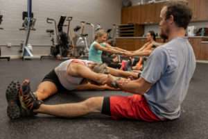 members of a fitness class stretching